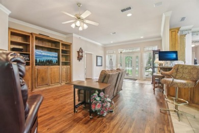 Walk out to the golf course from your large screened in back on Pecan Plantation Country Club in Texas - for sale on GolfHomes.com, golf home, golf lot