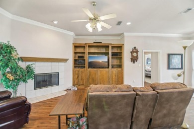 Walk out to the golf course from your large screened in back on Pecan Plantation Country Club in Texas - for sale on GolfHomes.com, golf home, golf lot