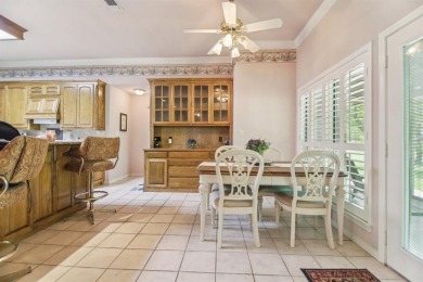 Walk out to the golf course from your large screened in back on Pecan Plantation Country Club in Texas - for sale on GolfHomes.com, golf home, golf lot