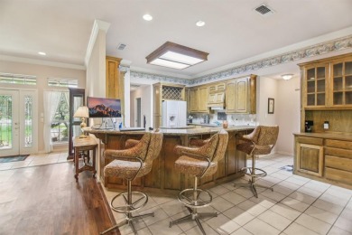 Walk out to the golf course from your large screened in back on Pecan Plantation Country Club in Texas - for sale on GolfHomes.com, golf home, golf lot