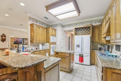Walk out to the golf course from your large screened in back on Pecan Plantation Country Club in Texas - for sale on GolfHomes.com, golf home, golf lot