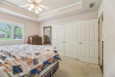 Walk out to the golf course from your large screened in back on Pecan Plantation Country Club in Texas - for sale on GolfHomes.com, golf home, golf lot