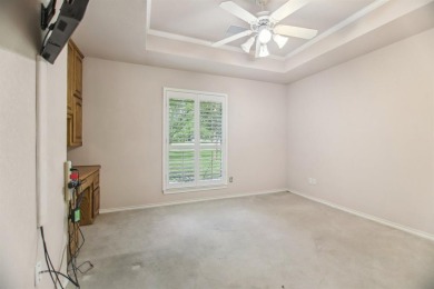 Walk out to the golf course from your large screened in back on Pecan Plantation Country Club in Texas - for sale on GolfHomes.com, golf home, golf lot
