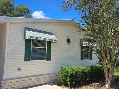 THIS PALM HARBOR 3/2 SPLIT PLAN FEATURES OVER 1300 SQ FT AND HAS on Southport Springs Golf Club in Florida - for sale on GolfHomes.com, golf home, golf lot