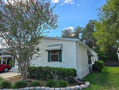 THIS PALM HARBOR 3/2 SPLIT PLAN FEATURES OVER 1300 SQ FT AND HAS on Southport Springs Golf Club in Florida - for sale on GolfHomes.com, golf home, golf lot