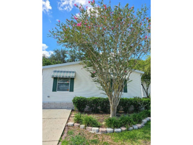THIS PALM HARBOR 3/2 SPLIT PLAN FEATURES OVER 1300 SQ FT AND HAS on Southport Springs Golf Club in Florida - for sale on GolfHomes.com, golf home, golf lot