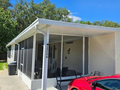 THIS PALM HARBOR 3/2 SPLIT PLAN FEATURES OVER 1300 SQ FT AND HAS on Southport Springs Golf Club in Florida - for sale on GolfHomes.com, golf home, golf lot