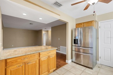 The ENCLOSED FLORIDA ROOM Under Heat and Air adds almost 450 sq on Highland Lakes Executive Golf Course in Florida - for sale on GolfHomes.com, golf home, golf lot