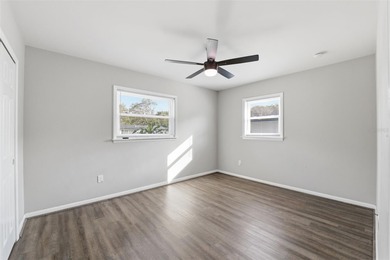 This beautifully maintained three-bedroom, two-bath home with a on The Dunedin Country Club in Florida - for sale on GolfHomes.com, golf home, golf lot