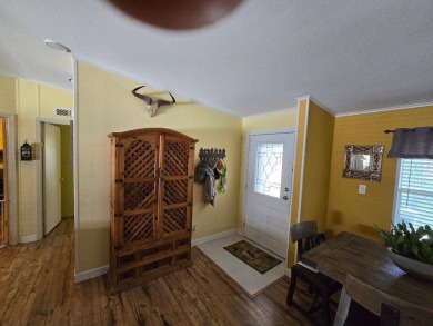 THIS PALM HARBOR 3/2 SPLIT PLAN FEATURES OVER 1300 SQ FT AND HAS on Southport Springs Golf Club in Florida - for sale on GolfHomes.com, golf home, golf lot