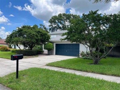 This beauty is priced to sell!!! Discover this spacious on Carrollwood Country Club in Florida - for sale on GolfHomes.com, golf home, golf lot