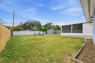 This beautifully maintained three-bedroom, two-bath home with a on The Dunedin Country Club in Florida - for sale on GolfHomes.com, golf home, golf lot