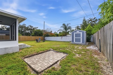 This beautifully maintained three-bedroom, two-bath home with a on The Dunedin Country Club in Florida - for sale on GolfHomes.com, golf home, golf lot