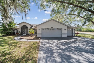 Located on a large corner lot along a peaceful canal, this on Spring Lake Golf Resort in Florida - for sale on GolfHomes.com, golf home, golf lot