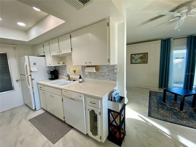 Under contract-accepting backup offers. Sunlight pours into this on Highland Lakes Executive Golf Course in Florida - for sale on GolfHomes.com, golf home, golf lot