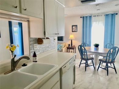 Under contract-accepting backup offers. Sunlight pours into this on Highland Lakes Executive Golf Course in Florida - for sale on GolfHomes.com, golf home, golf lot