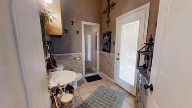 Beautifully situated on 2.3 private acres in the gated, golfing on Pecan Plantation Country Club in Texas - for sale on GolfHomes.com, golf home, golf lot