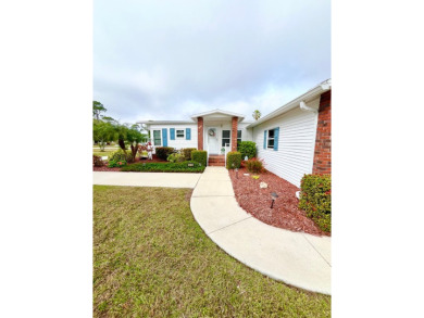 Welcome to this beautifully cared-for home in the gated golf on Pine Lakes Country Club in Florida - for sale on GolfHomes.com, golf home, golf lot
