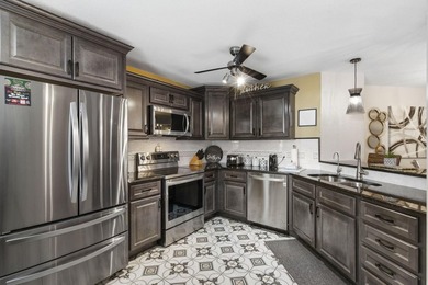 Looking for a walk-in unit? This condo would be perfect for you on Pointe Royale Village Country Club in Missouri - for sale on GolfHomes.com, golf home, golf lot