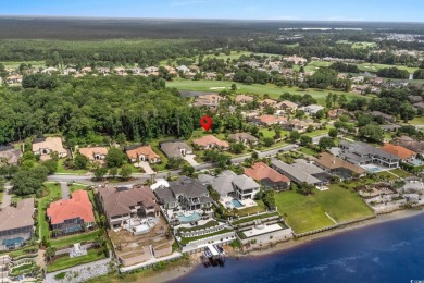 Experience luxury living at its finest at 9590 Bellasera Circle on The Members Club At Grande Dunes in South Carolina - for sale on GolfHomes.com, golf home, golf lot