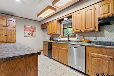 This home has so much potential and offers an affordable entry on Hide-A-Way Lake Golf Course in Texas - for sale on GolfHomes.com, golf home, golf lot
