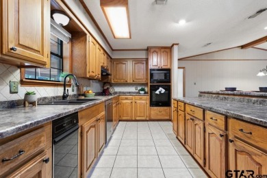 This home has so much potential and offers an affordable entry on Hide-A-Way Lake Golf Course in Texas - for sale on GolfHomes.com, golf home, golf lot
