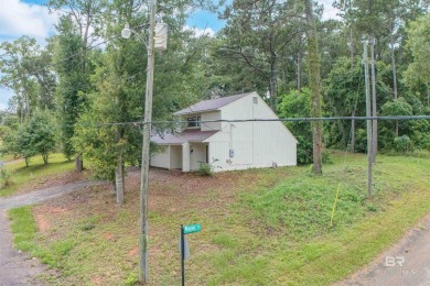 Nestled on a quiet corner lot near the Lawson Road entrance, and on Lake Forest Yacht and Country Club in Alabama - for sale on GolfHomes.com, golf home, golf lot