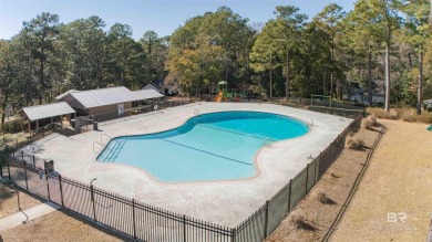 Nestled on a quiet corner lot near the Lawson Road entrance, and on Lake Forest Yacht and Country Club in Alabama - for sale on GolfHomes.com, golf home, golf lot