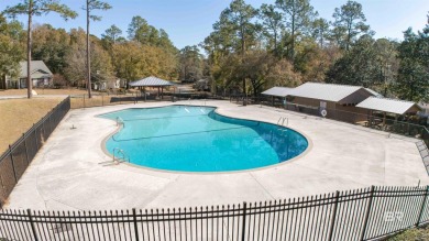 Nestled on a quiet corner lot near the Lawson Road entrance, and on Lake Forest Yacht and Country Club in Alabama - for sale on GolfHomes.com, golf home, golf lot