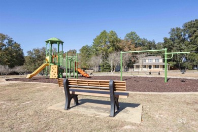 Nestled on a quiet corner lot near the Lawson Road entrance, and on Lake Forest Yacht and Country Club in Alabama - for sale on GolfHomes.com, golf home, golf lot