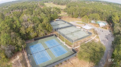 Nestled on a quiet corner lot near the Lawson Road entrance, and on Lake Forest Yacht and Country Club in Alabama - for sale on GolfHomes.com, golf home, golf lot