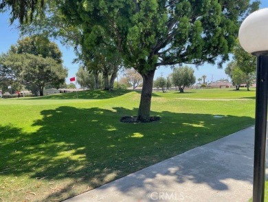 (Mutual 14-2-L)... Steps to GOLF COURSE with a glimpse of the on Leisure World Seal Beach Golf Course in California - for sale on GolfHomes.com, golf home, golf lot