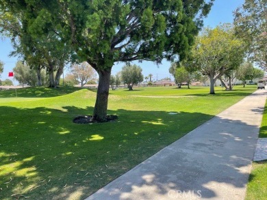 (Mutual 14-2-L)... Steps to GOLF COURSE with a glimpse of the on Leisure World Seal Beach Golf Course in California - for sale on GolfHomes.com, golf home, golf lot