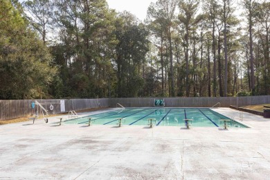 Nestled on a quiet corner lot near the Lawson Road entrance, and on Lake Forest Yacht and Country Club in Alabama - for sale on GolfHomes.com, golf home, golf lot