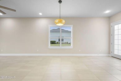 Step into easy living in Plantation Bay! This stylish 2-bedroom on Plantation Bay Golf and Country Club in Florida - for sale on GolfHomes.com, golf home, golf lot