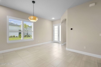 Step into easy living in Plantation Bay! This stylish 2-bedroom on Plantation Bay Golf and Country Club in Florida - for sale on GolfHomes.com, golf home, golf lot