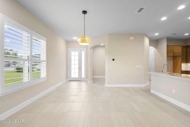 Step into easy living in Plantation Bay! This stylish 2-bedroom on Plantation Bay Golf and Country Club in Florida - for sale on GolfHomes.com, golf home, golf lot