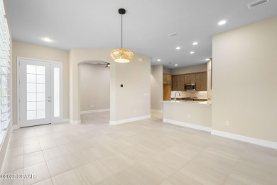 Step into easy living in Plantation Bay! This stylish 2-bedroom on Plantation Bay Golf and Country Club in Florida - for sale on GolfHomes.com, golf home, golf lot