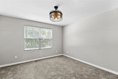 This must-see 3-bedroom, 2-full bath residence is situated on on Raintree Country Club in Missouri - for sale on GolfHomes.com, golf home, golf lot