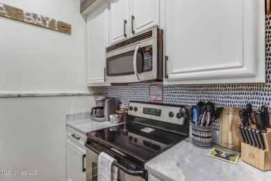 Step into coastal charm with this beautifully updated 2-bedroom on The Bridges Golf Club At Hollywood Casino in Mississippi - for sale on GolfHomes.com, golf home, golf lot