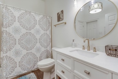 Step into coastal charm with this beautifully updated 2-bedroom on The Bridges Golf Club At Hollywood Casino in Mississippi - for sale on GolfHomes.com, golf home, golf lot