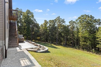 This must-see 3-bedroom, 2-full bath residence is situated on on Raintree Country Club in Missouri - for sale on GolfHomes.com, golf home, golf lot