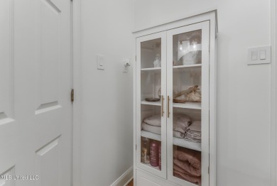 Step into coastal charm with this beautifully updated 2-bedroom on The Bridges Golf Club At Hollywood Casino in Mississippi - for sale on GolfHomes.com, golf home, golf lot