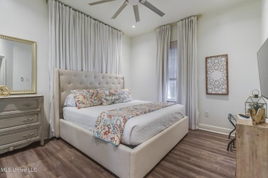 Step into coastal charm with this beautifully updated 2-bedroom on The Bridges Golf Club At Hollywood Casino in Mississippi - for sale on GolfHomes.com, golf home, golf lot