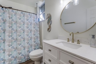 Step into coastal charm with this beautifully updated 2-bedroom on The Bridges Golf Club At Hollywood Casino in Mississippi - for sale on GolfHomes.com, golf home, golf lot