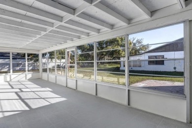 Incredible 3-bedroom/2-bathroom home with a large, attached on Palm Harbor Golf Club in Florida - for sale on GolfHomes.com, golf home, golf lot