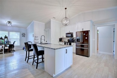 Welcome to this beautifully renovated 4 bedroom, 2 bathroom home on Sun n Lake Golf and Country Club in Florida - for sale on GolfHomes.com, golf home, golf lot