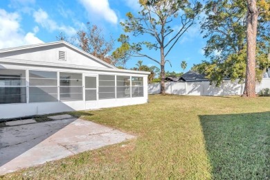 Incredible 3-bedroom/2-bathroom home with a large, attached on Palm Harbor Golf Club in Florida - for sale on GolfHomes.com, golf home, golf lot