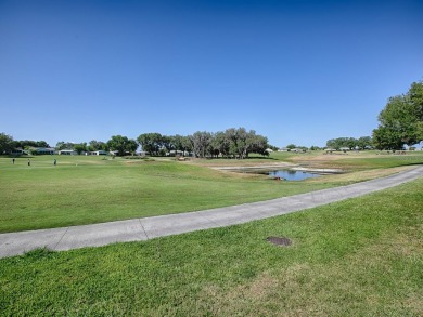 Do you want to live with a BEAUTIFUL GOLF COURSE AND WATER VIEW on Lakes of Lady Lake Golf Course in Florida - for sale on GolfHomes.com, golf home, golf lot