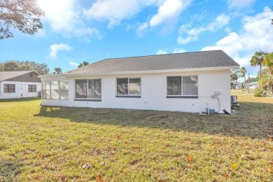 Incredible 3-bedroom/2-bathroom home with a large, attached on Palm Harbor Golf Club in Florida - for sale on GolfHomes.com, golf home, golf lot